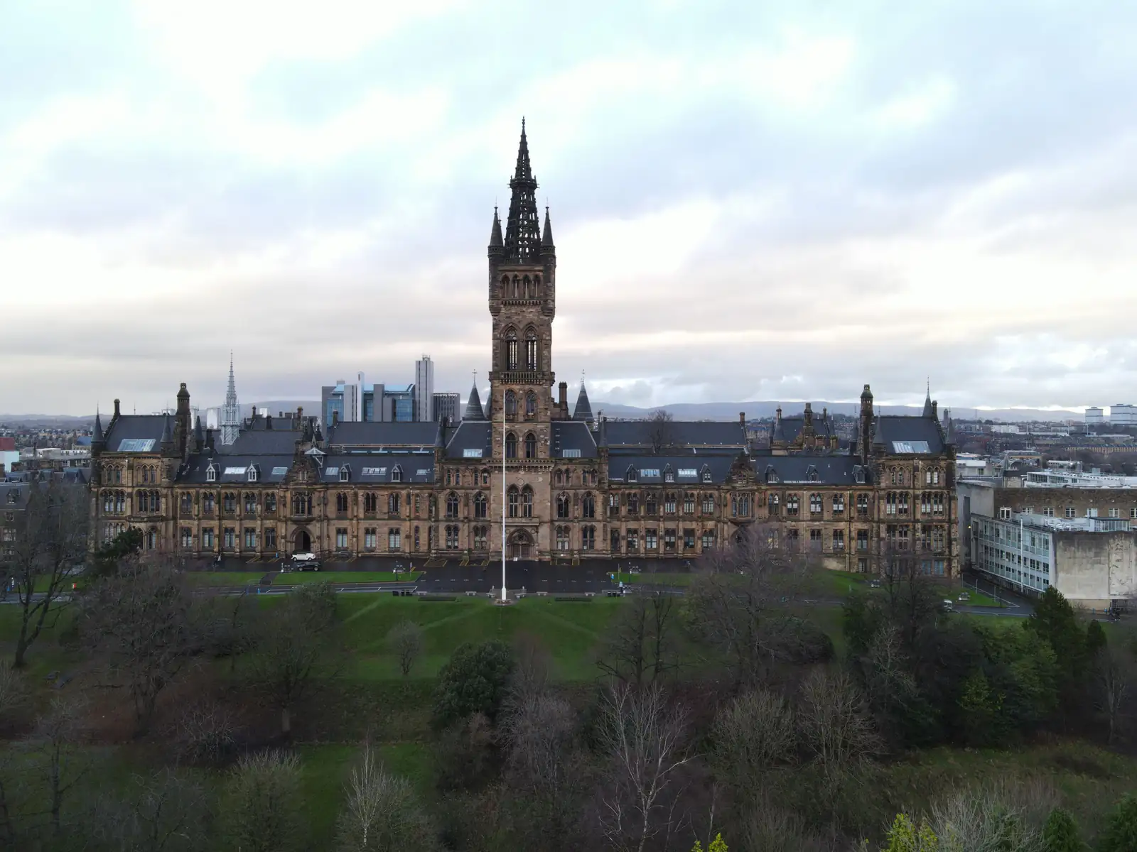 Aerial view of the University of Glasgow tower rising above Kelvingrove Park and the West End
